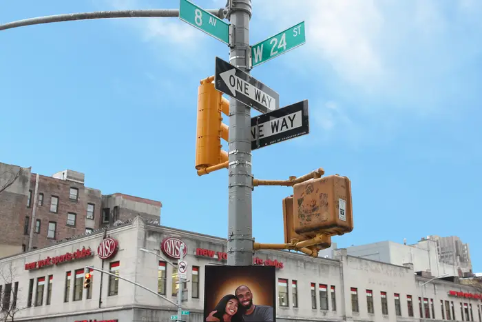 A portrait of Kobe and Gianna Bryant posted on a street sign located at 24th Street and 8th Avenue; those are the two numbers (24 & 8) that represented Kobe Bryant's retired NBA numbers for the LA Lakers.